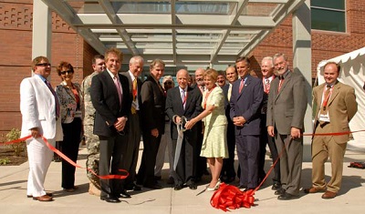 John A. Moran, center, holds scissors at the 2006 ribbon-cutting ceremony.