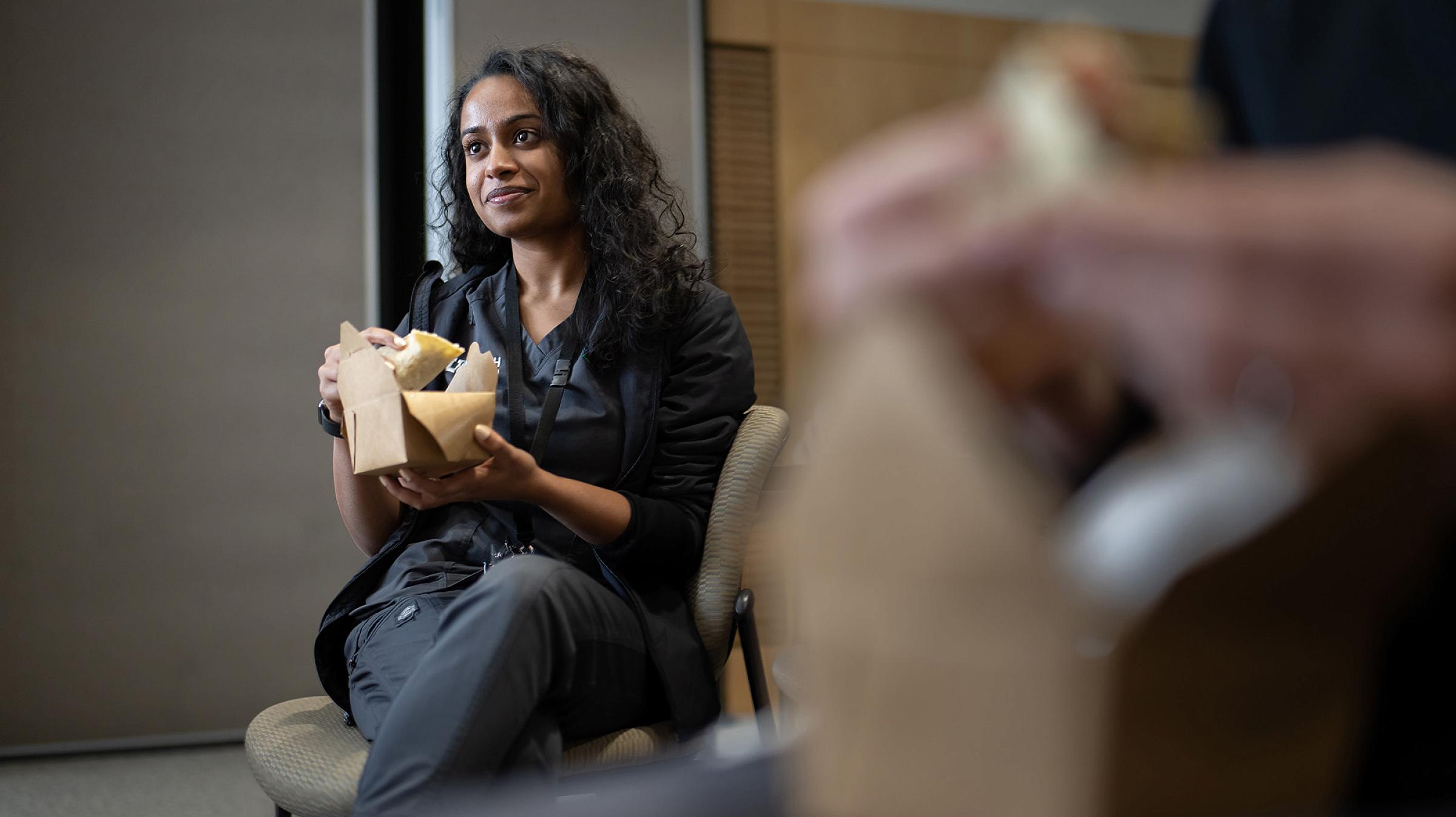 Resident Abigail Jebaraj, MD, listens to a TACO Tuesday presentation.