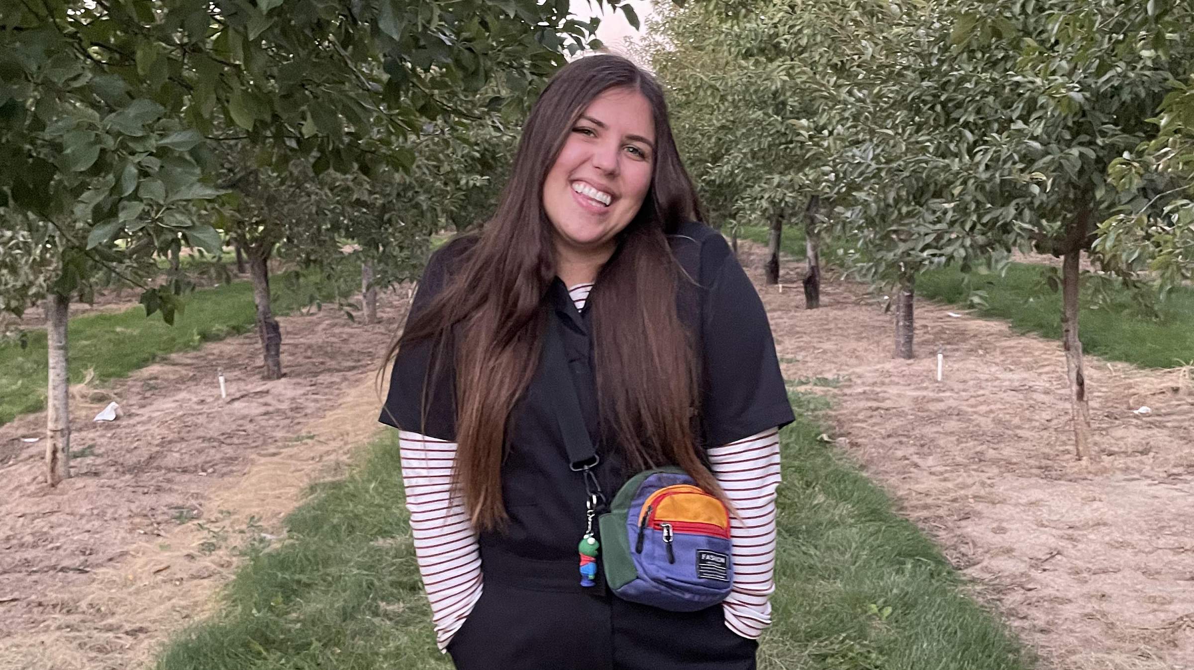 Jena nursing student smiling in a grove of trees