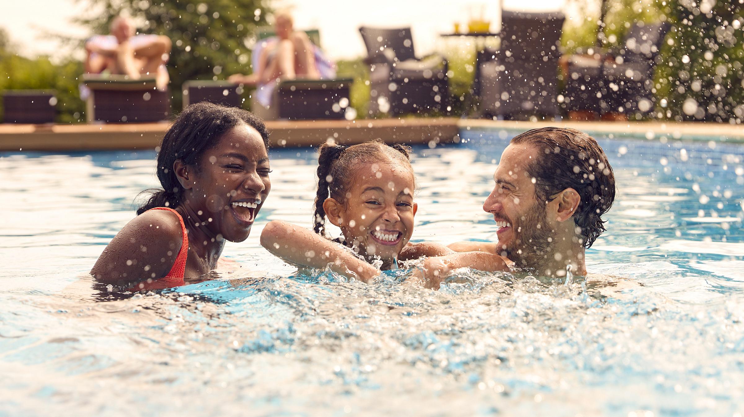 Family in swimming pool.