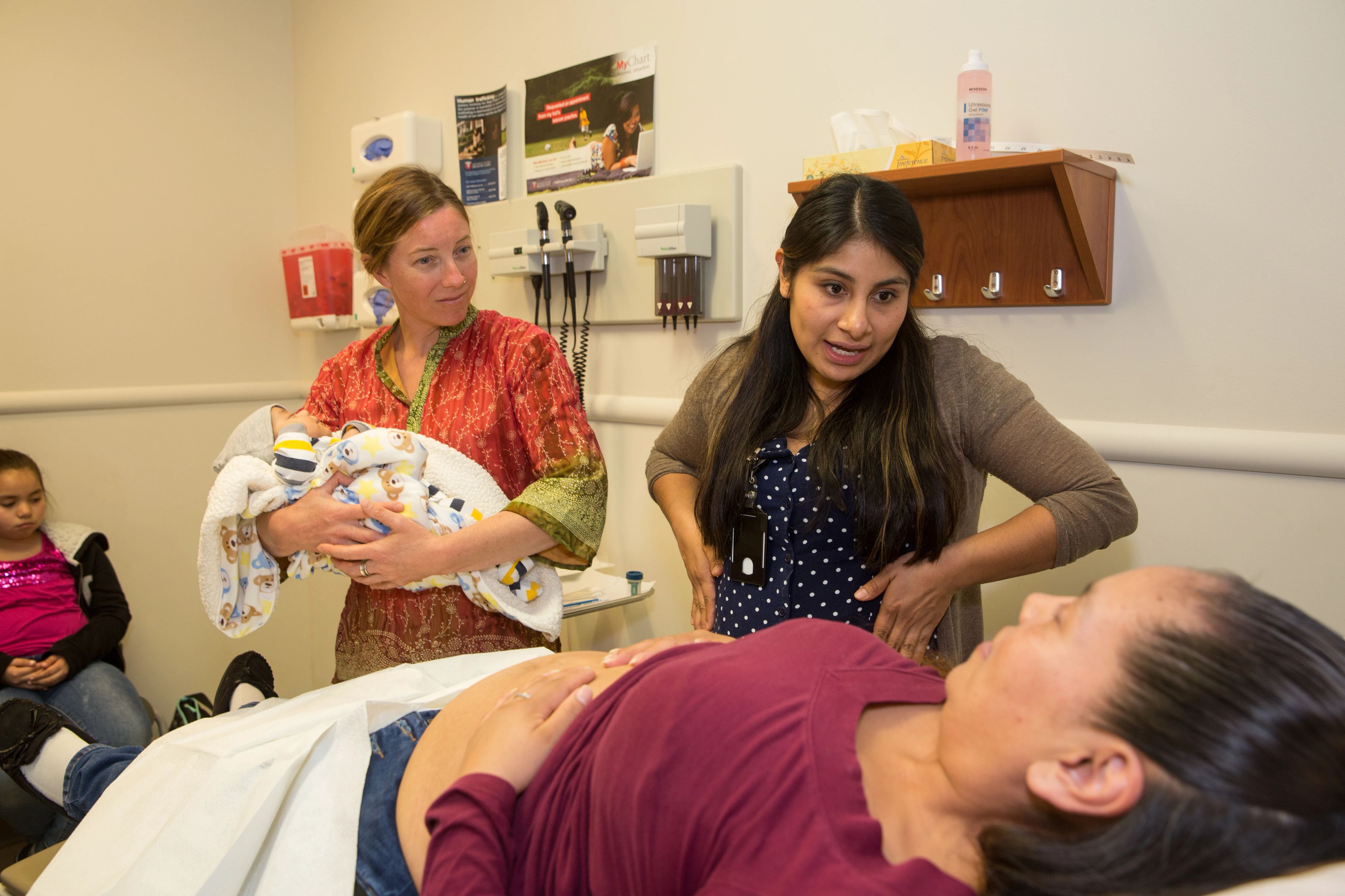 Expecting mother talking with her doctor