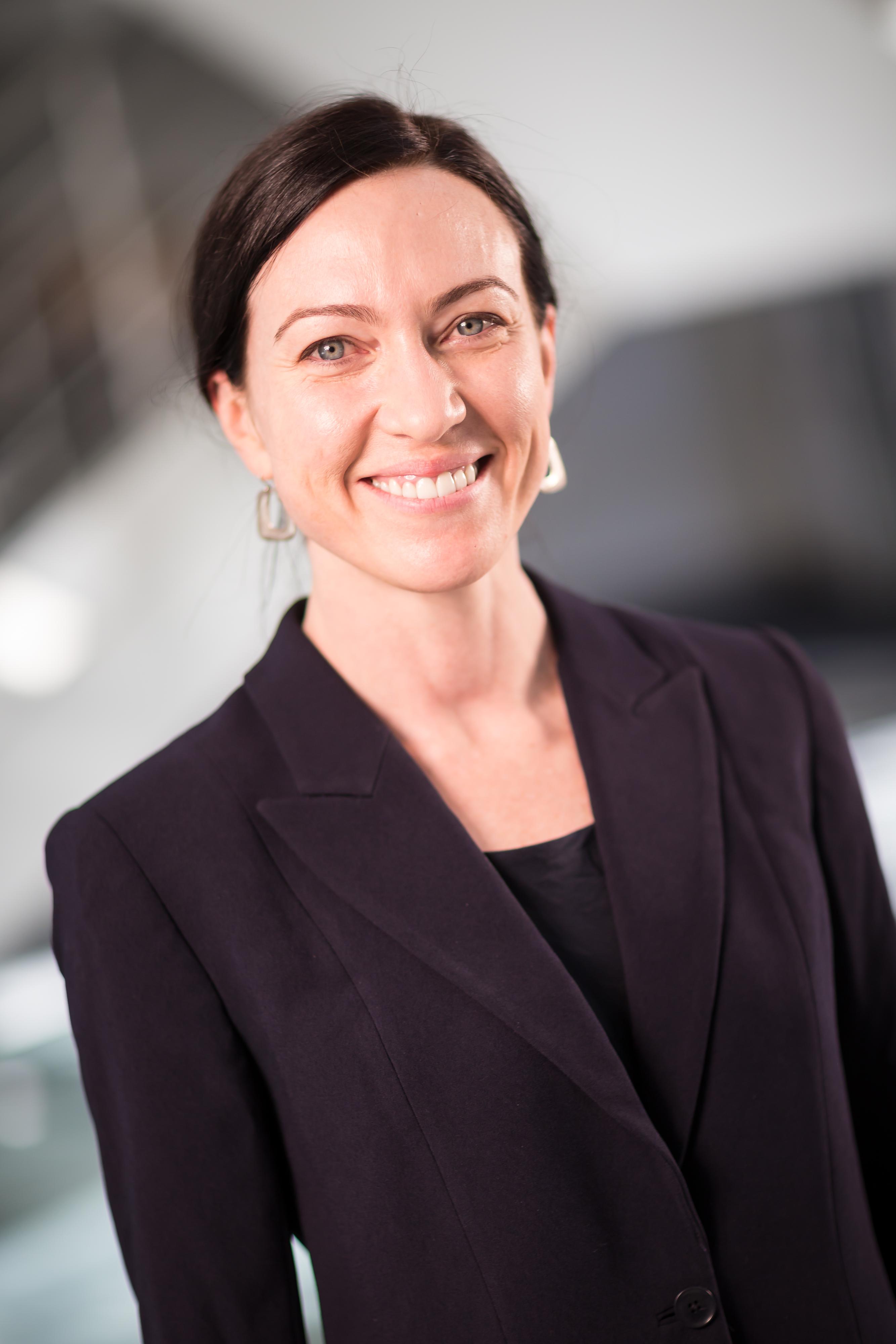 Anna Docherty headshot. She is wearing a black blazer.