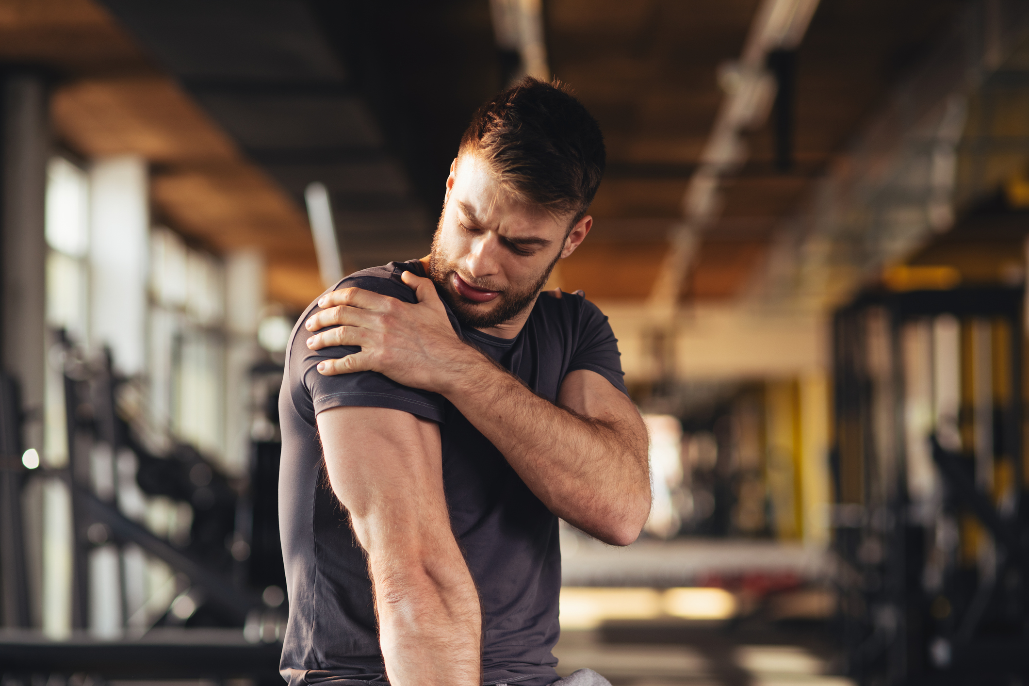 Man rubbing shoulder