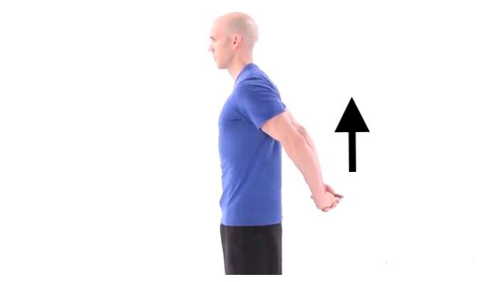 Person pulling their arms up away from their body with their arms behind their back and fingers interlocked