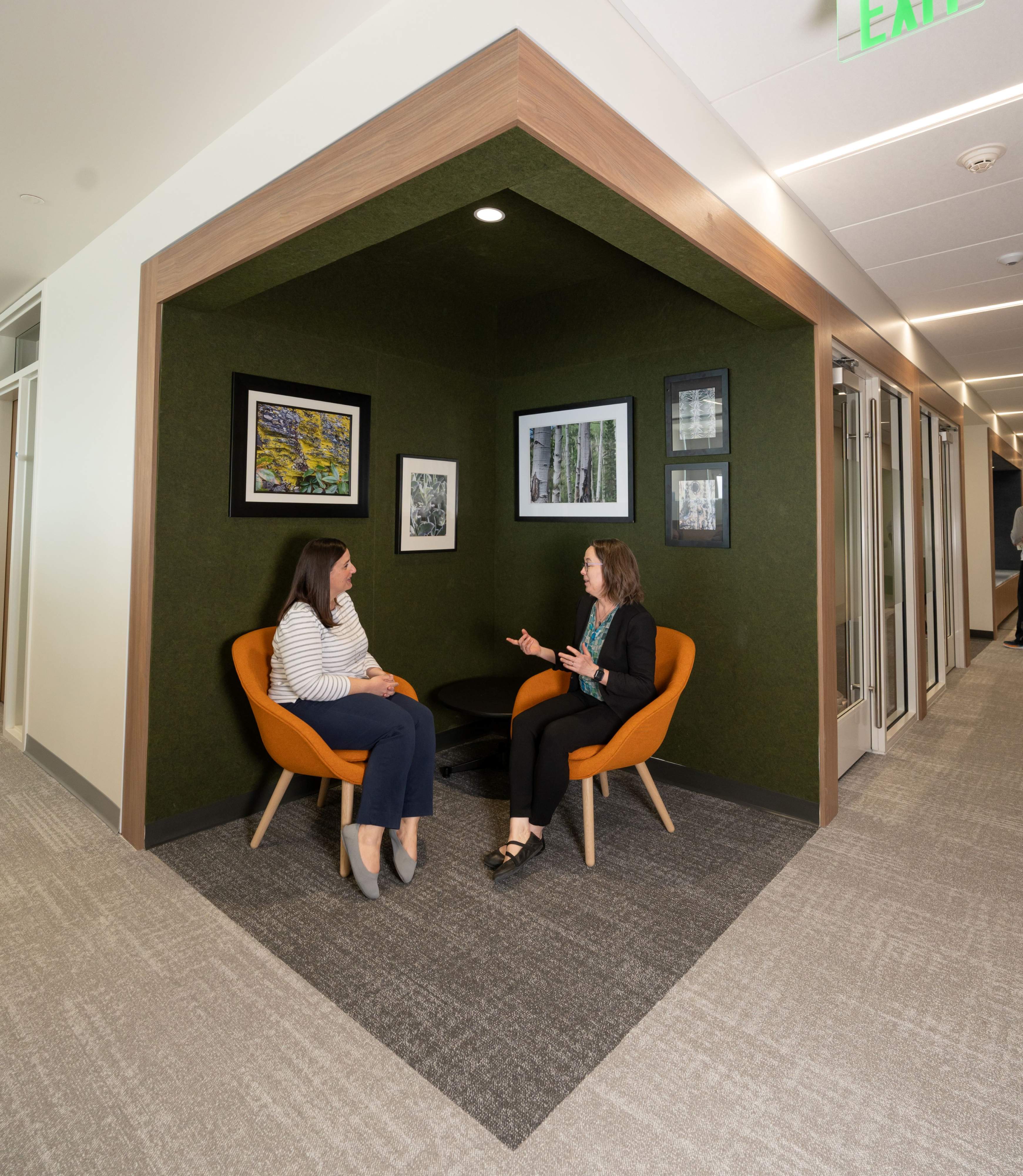 Dr. Amy Locke connects with Ellen Maxfield in an alcove of the office