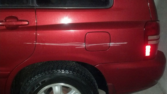 Car with a scrape on it