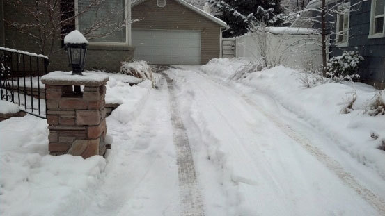 DRIVE WAY WITH SNOW ON IT