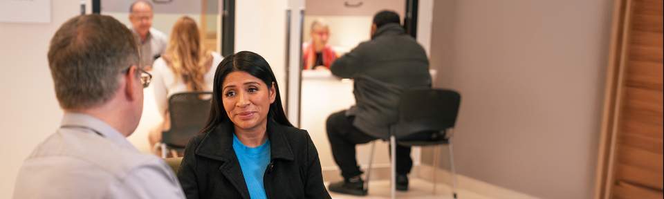 Women talking to a doctor.
