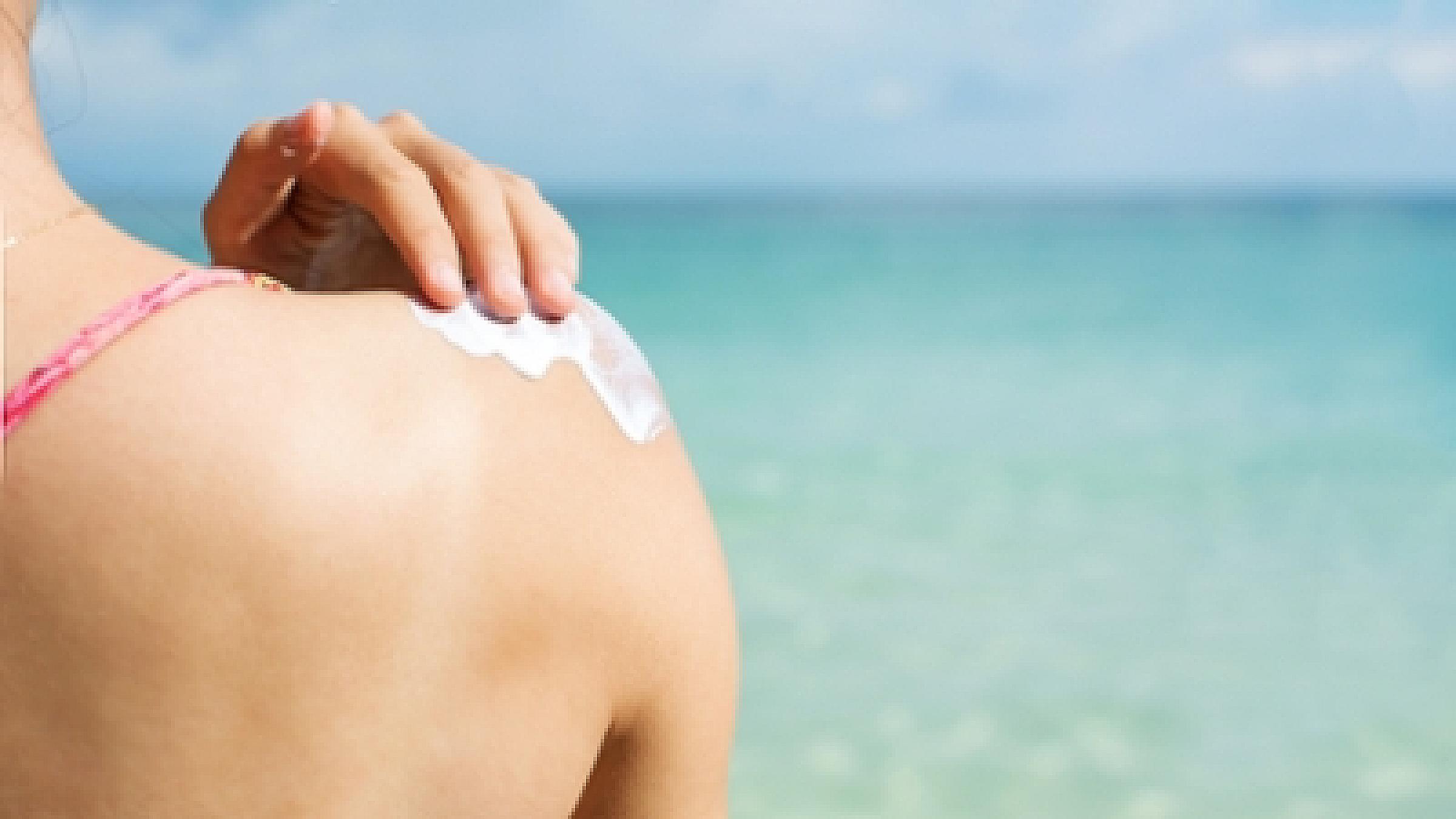 Person putting on sunscreen