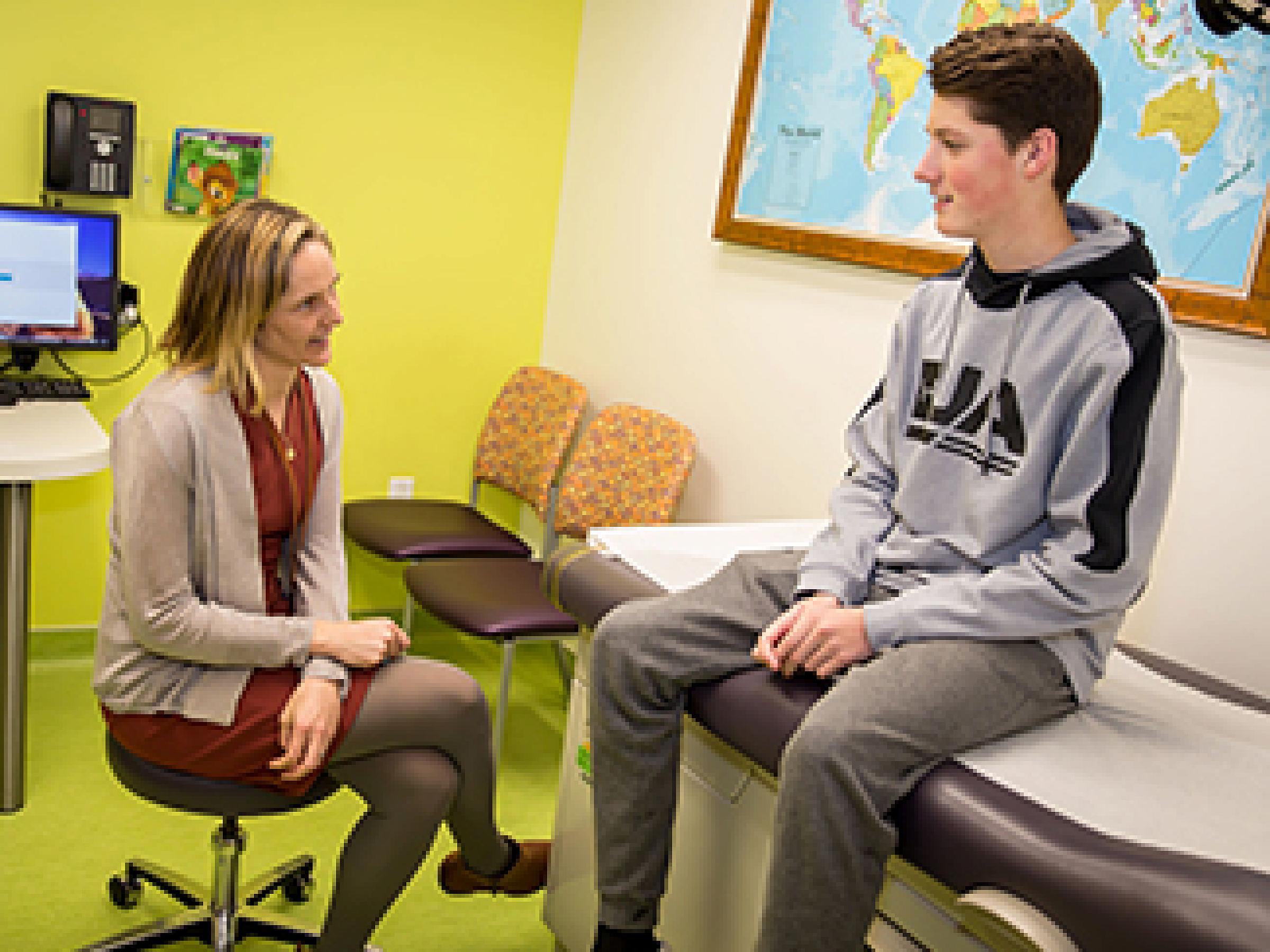 Brock talking with his pectus excavatum surgeon Katie Russell, MD