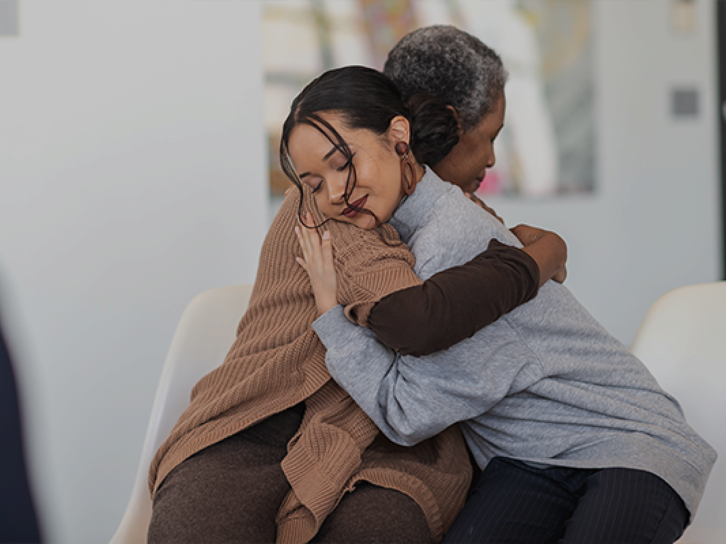 Mother and daughter hugging. 