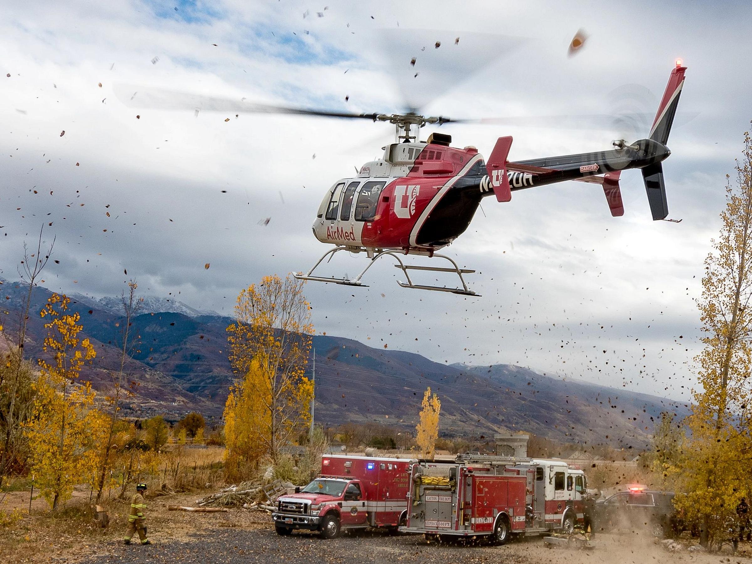 AirMed Helicopter over boulders and trees