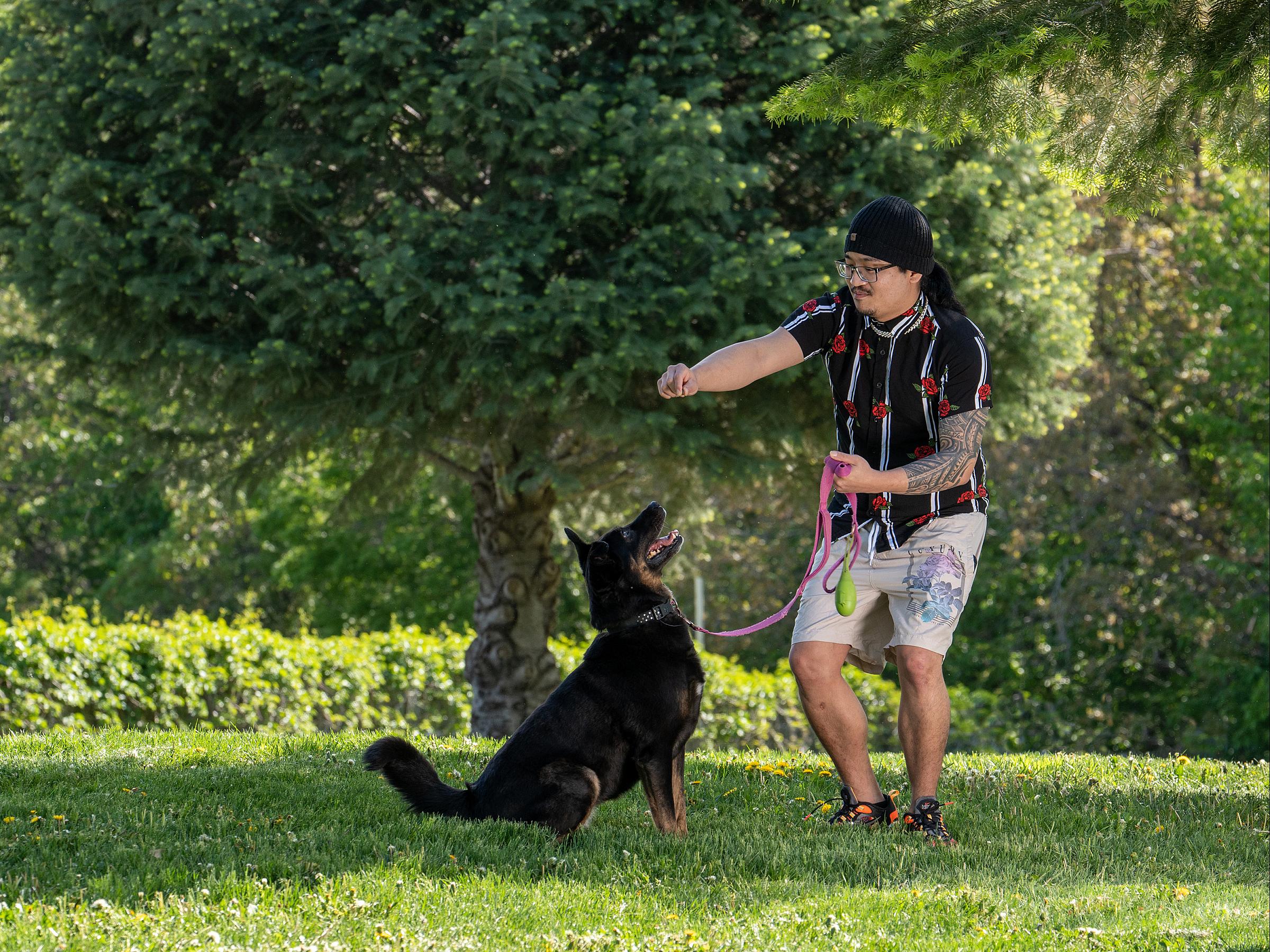 Su Lee with his dog after successful heart surgery