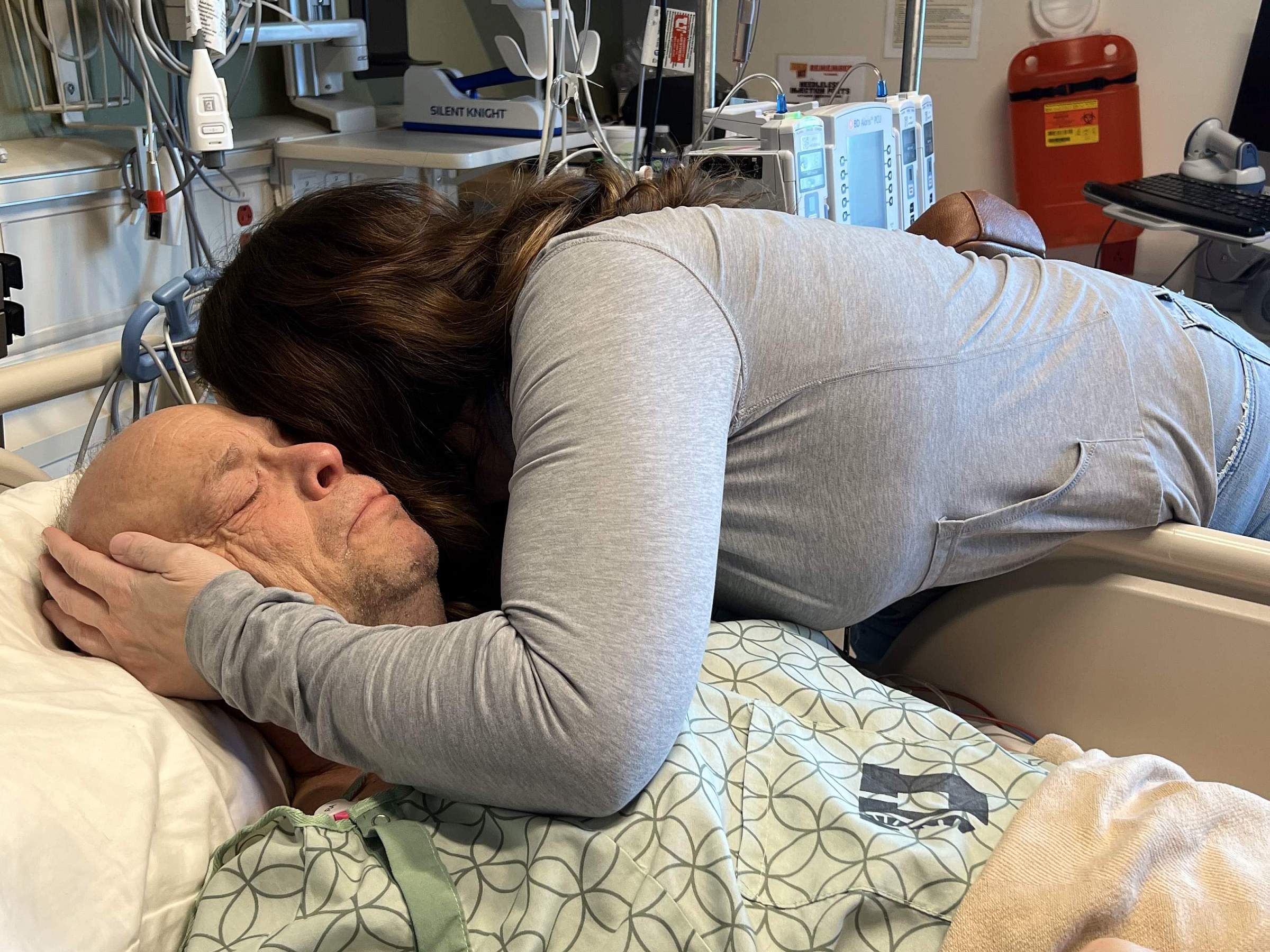 Joseph McComber in the Hospital after surgery with his wife