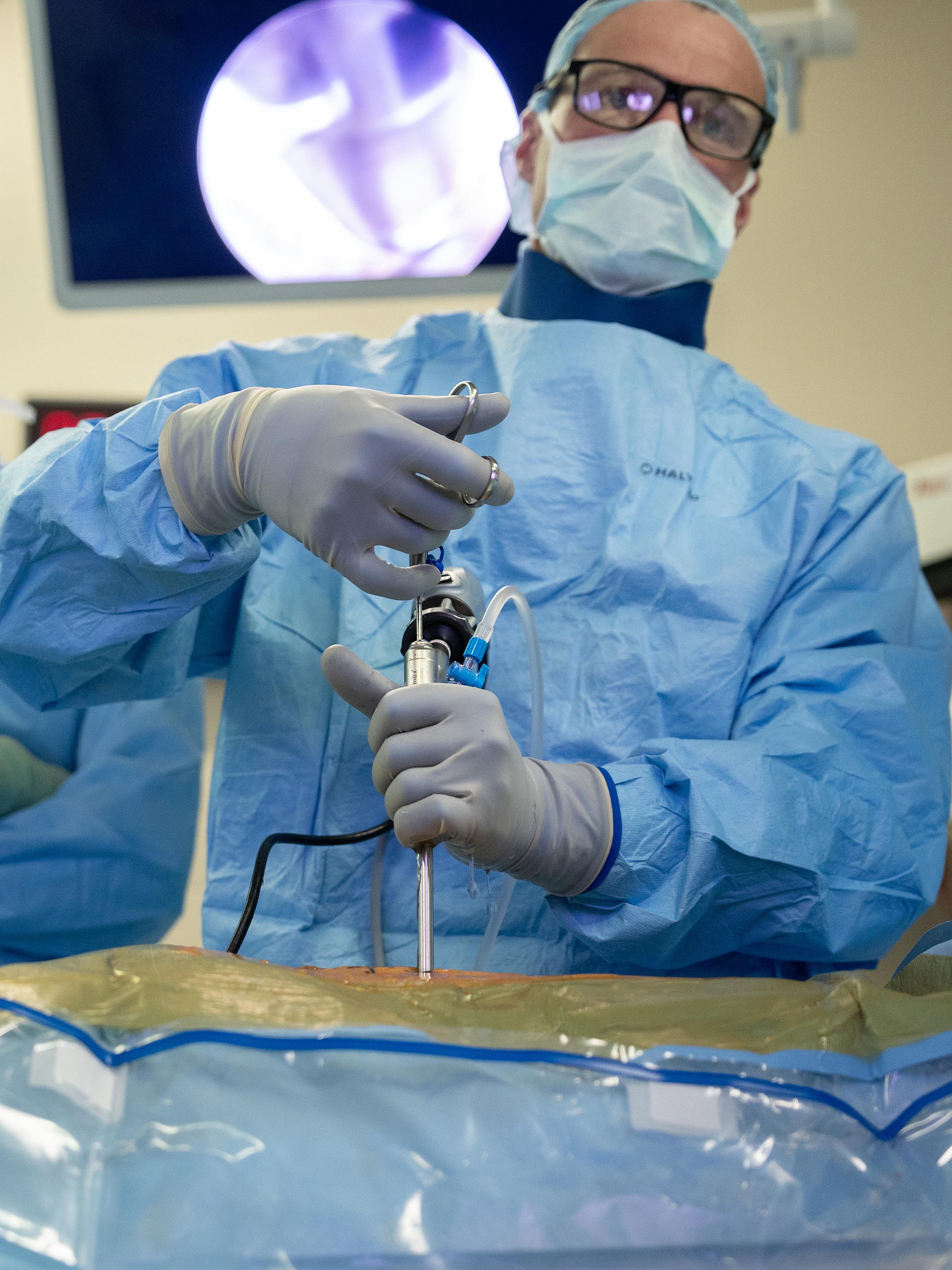 U of U Health neurosurgeon performs endoscopic spine surgery on patient.