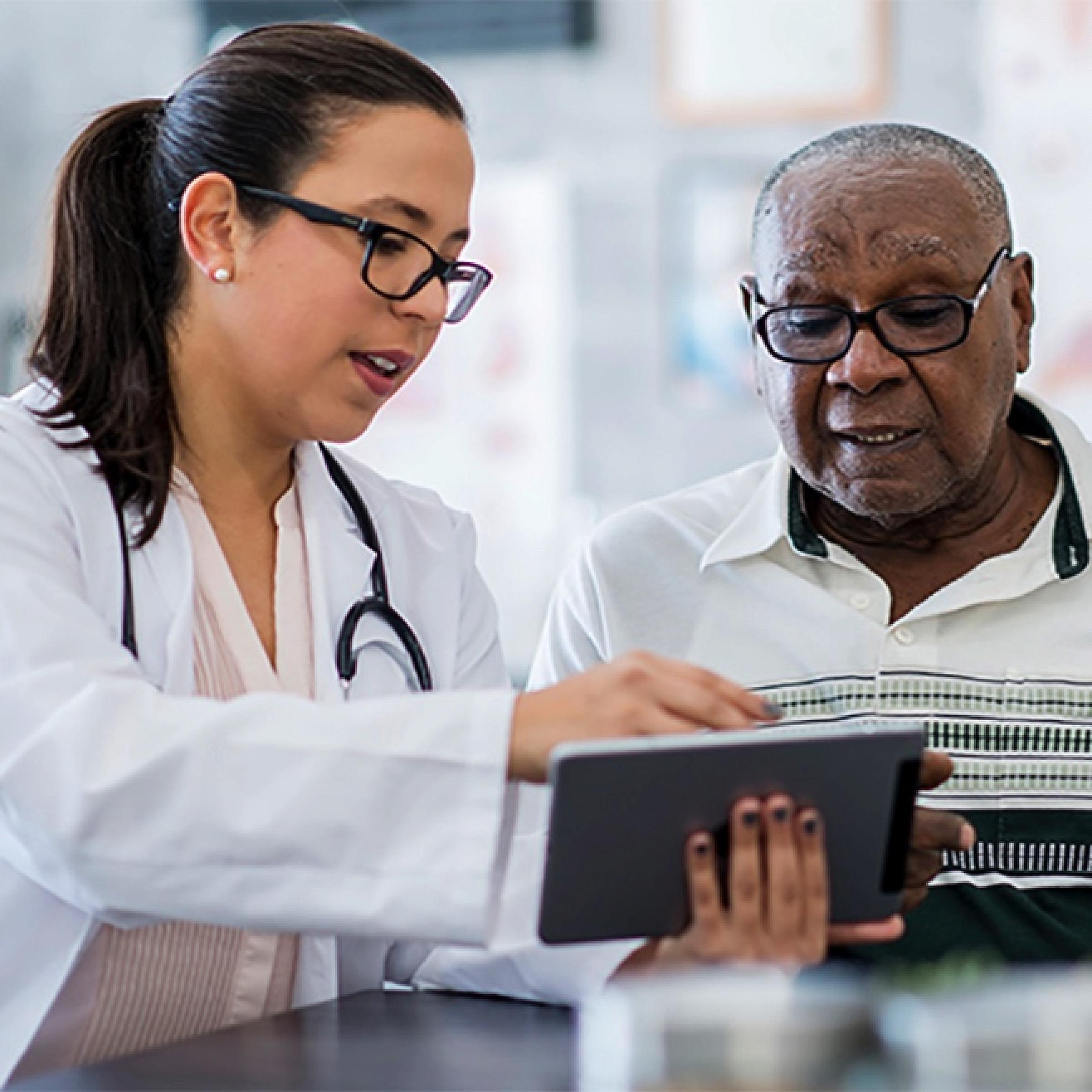 elderly man discusses with patient