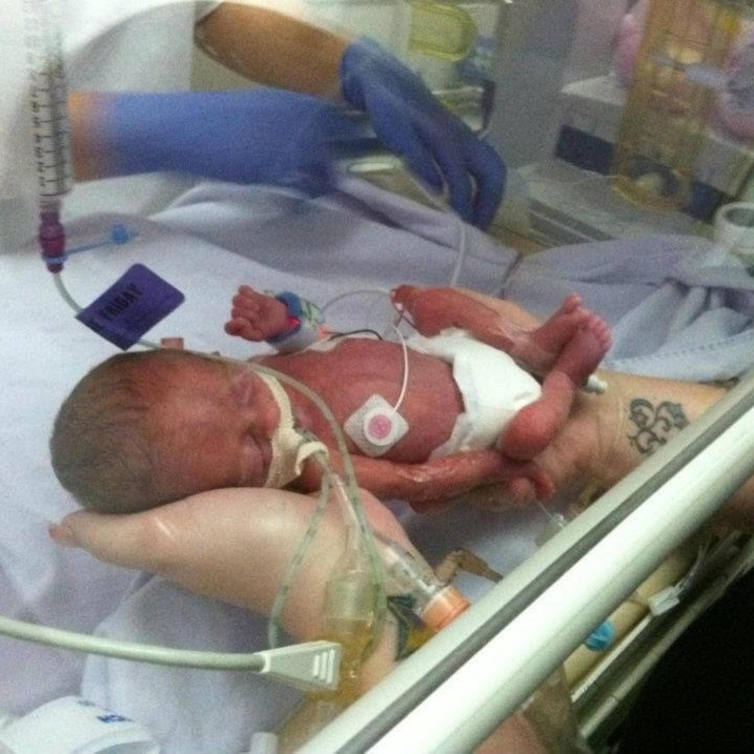 Bentley in their parent's hands