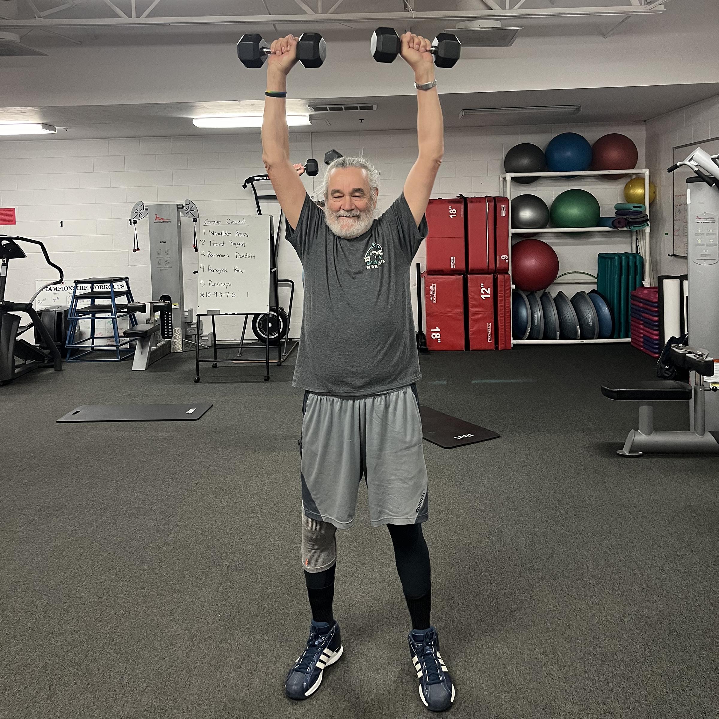 Lee Shuster lifting weights