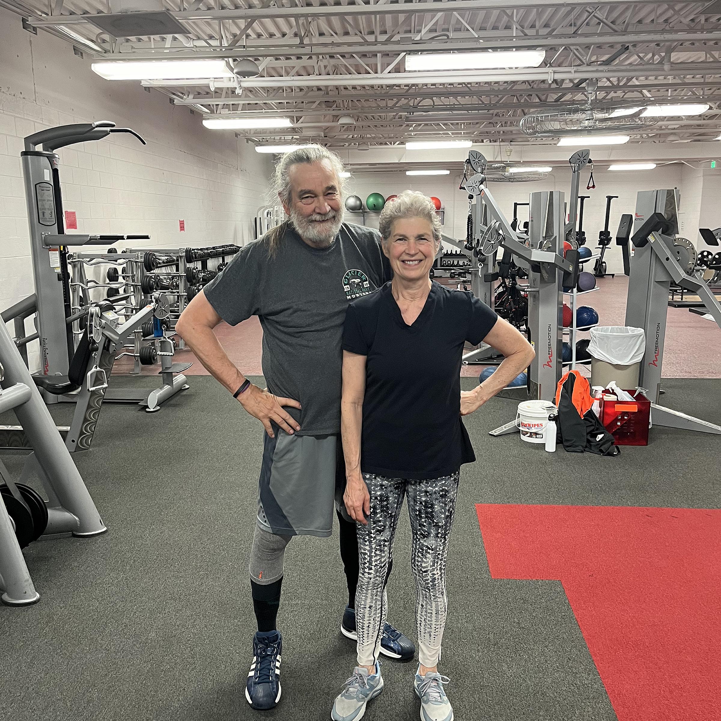 Linda Smith and her husband, Lee Shuster pose together at the gym