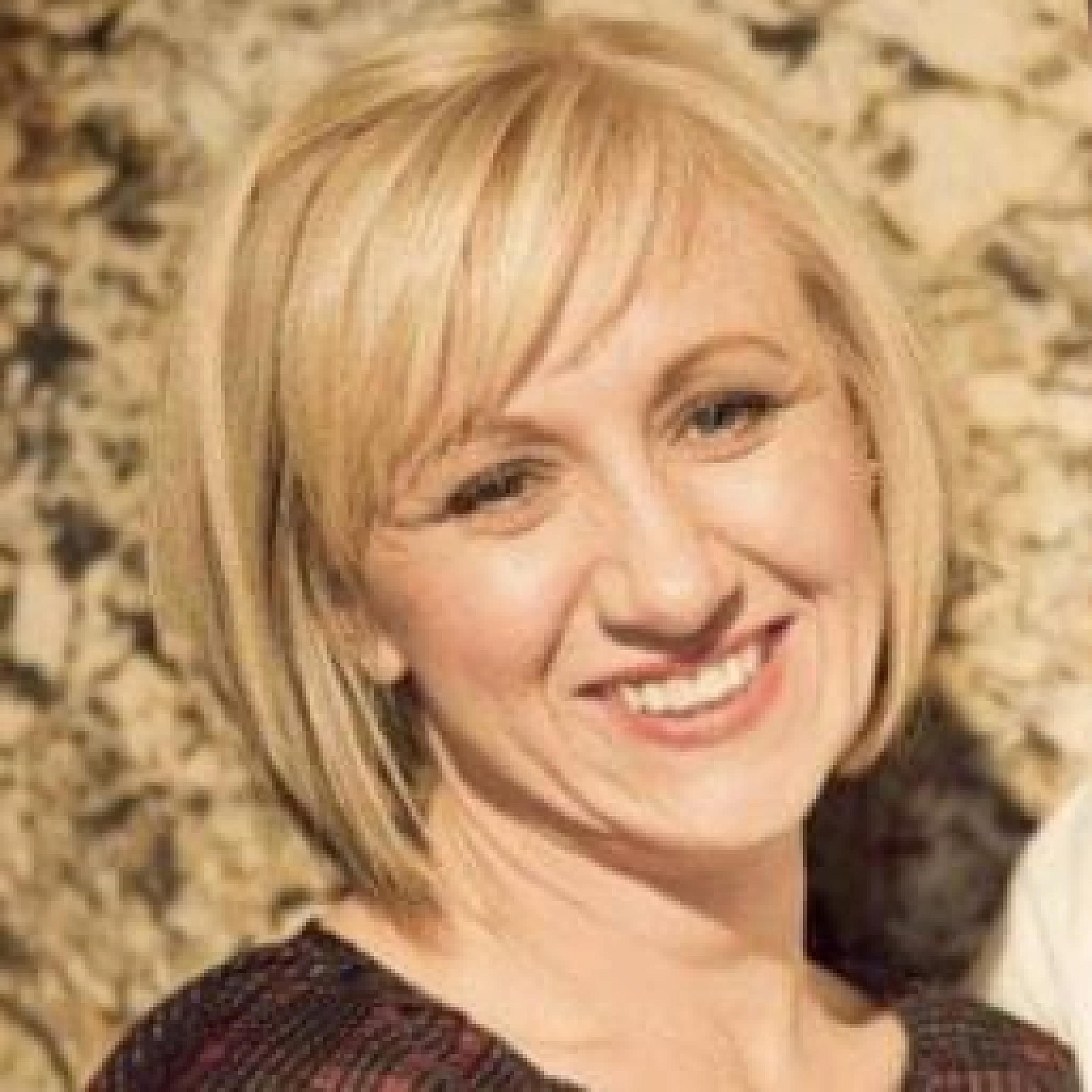 Angela Milner has short blonde hair.