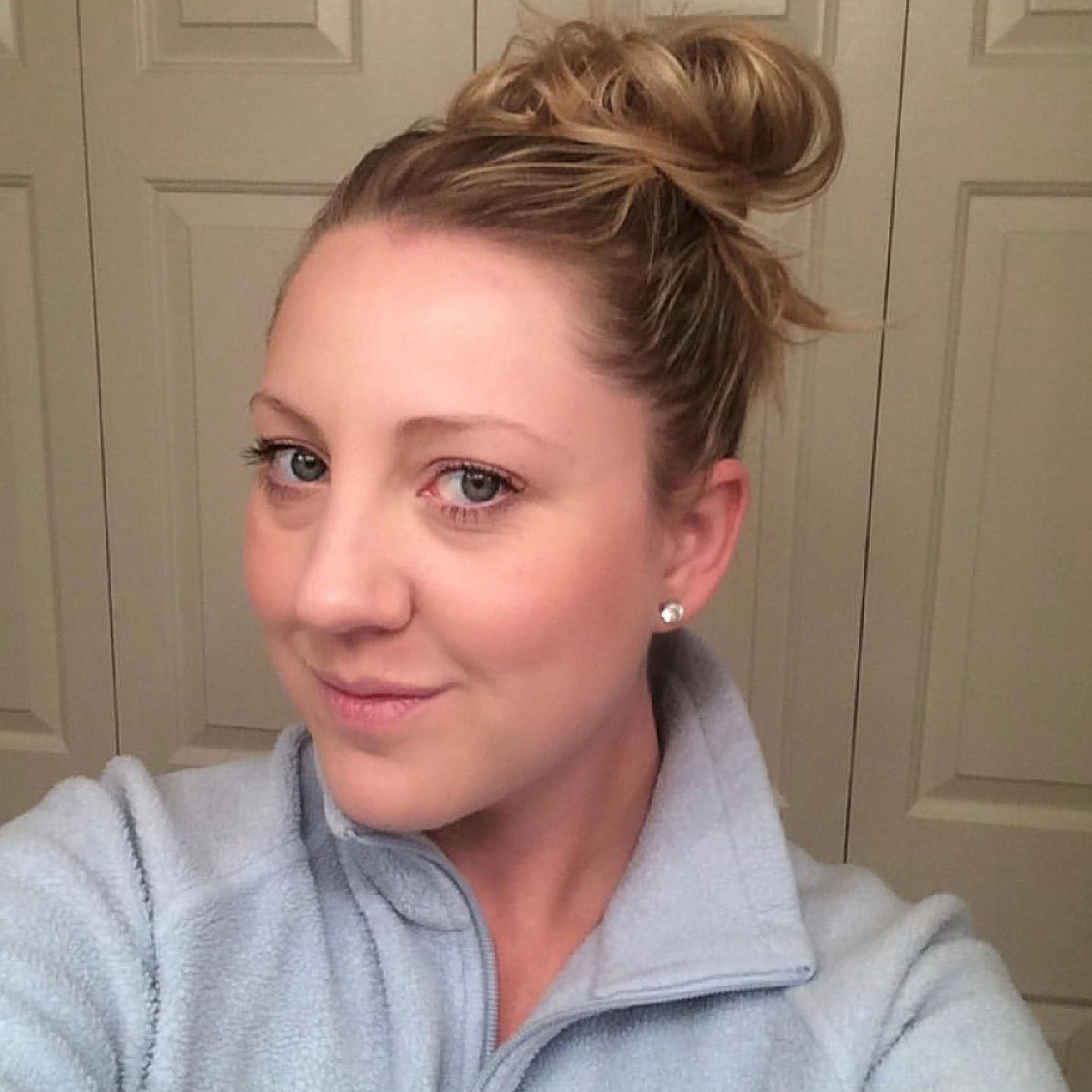 Reylia Morford wears a light blue shirt and has her blonde hair in a bun