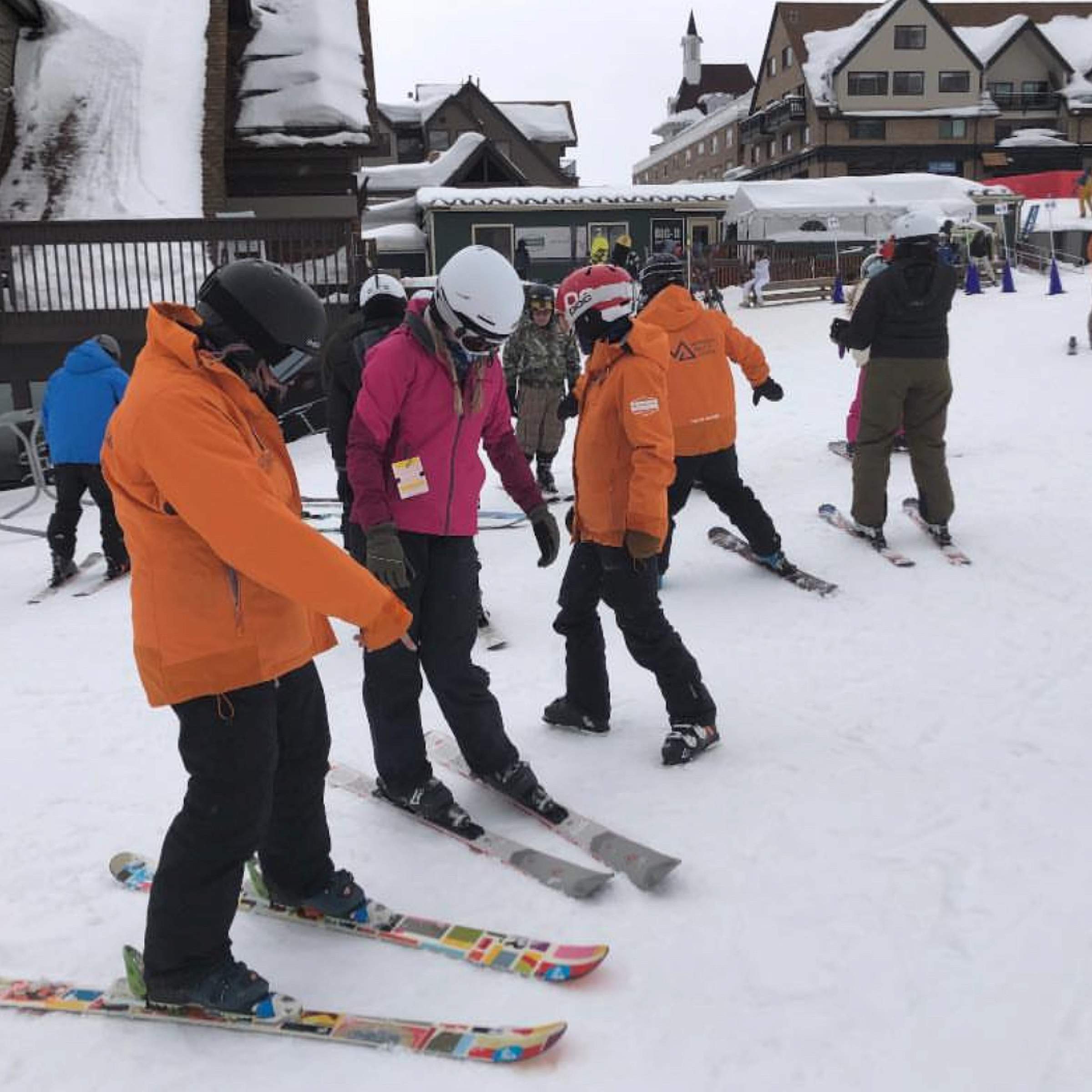Four burn camp attendees skiing