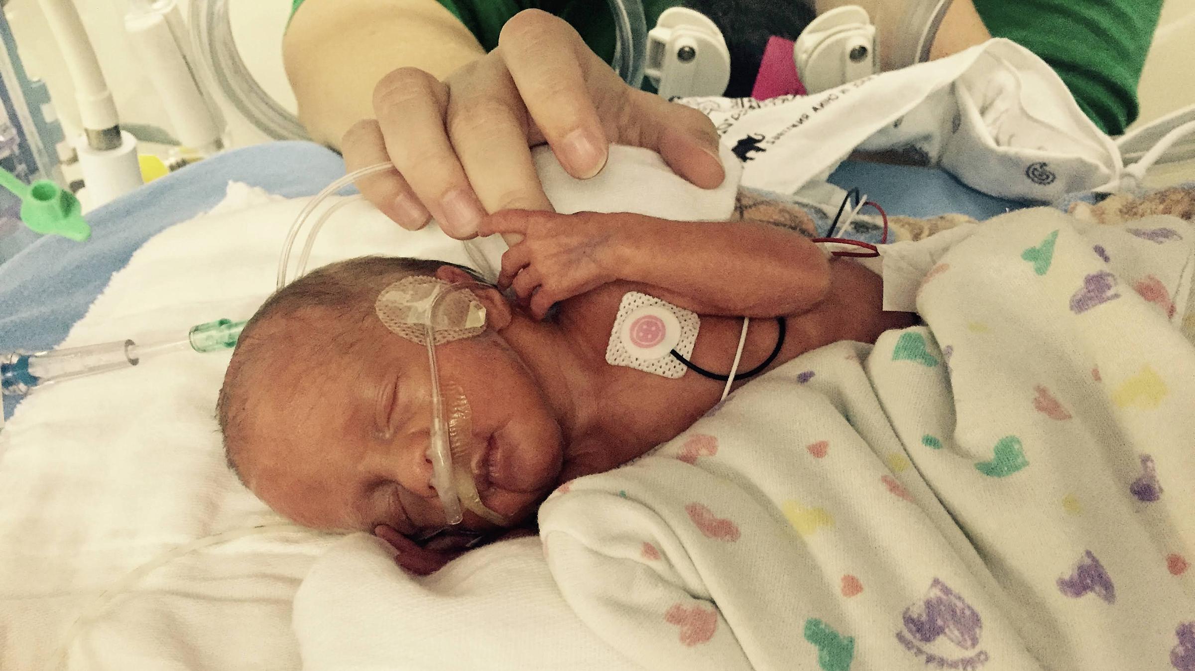 Temple Yost in the NICU next to parent
