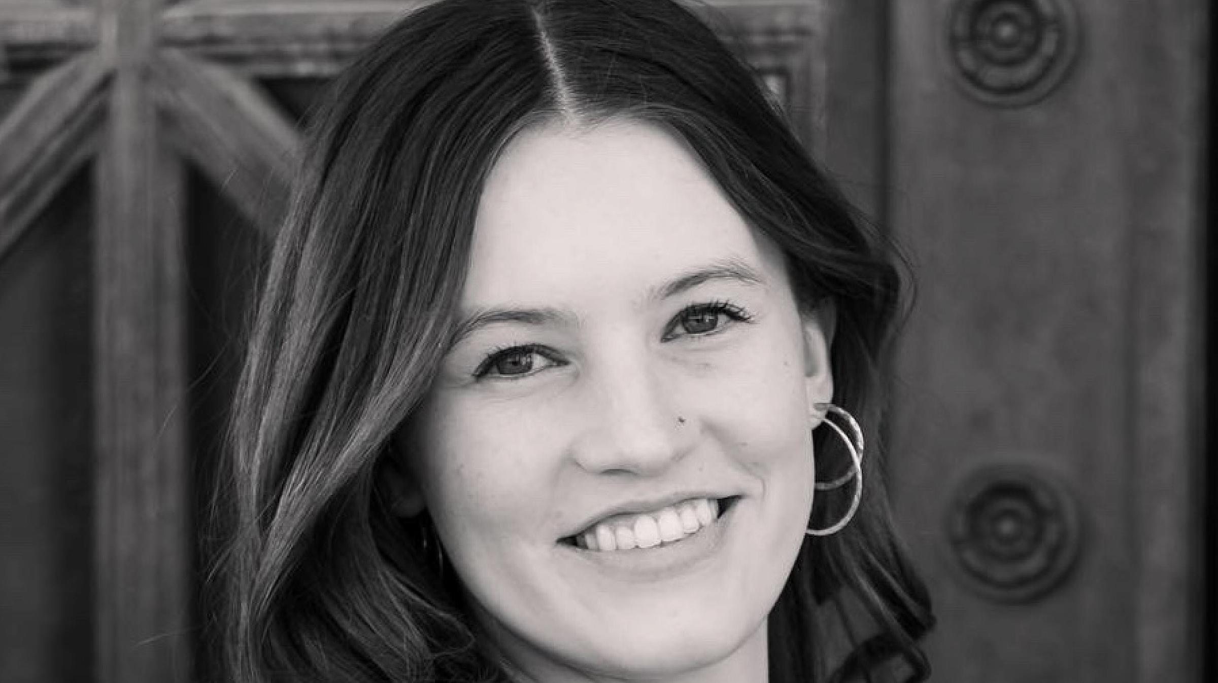 Annabelle Baumgartner has short, dark hair and wears a black top. 