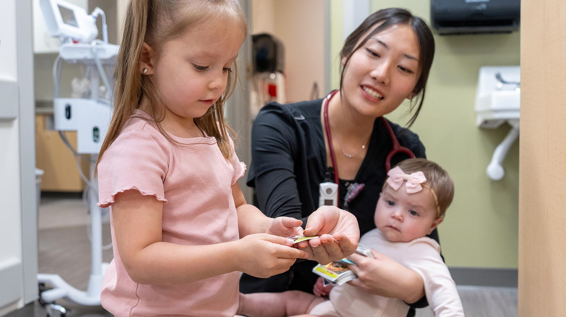 Child and baby with pediatrics provider